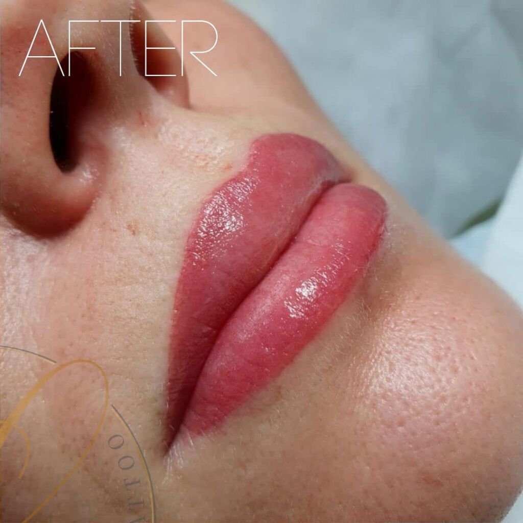 Close-up of a person's vibrant pink lips immediately after permanent makeup application, with the word 'AFTER' visible.