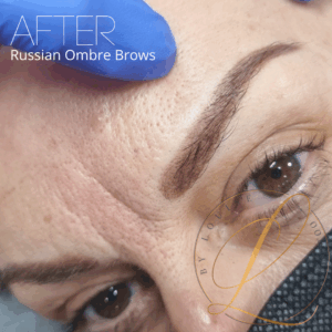Close-up of a person's eye and eyebrow after a Russian Ombre Brows procedure, showing the defined brow and skin texture.